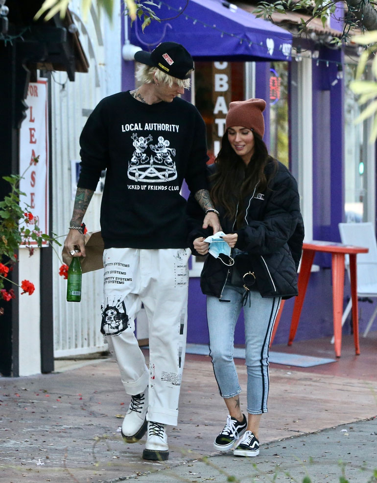 Happy couple Megan Fox and Machine Gun Kelly pick up food and drinks to go while out enjoying a day together.