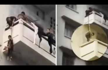 Vaarallista! Isoäiti laski lapsenlapsensa köyden varassa parvekkeelta kissaa hakemaan!